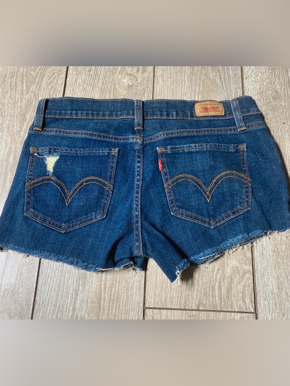 Levi's low-rise denim cutoff shorts Distressed Size 7